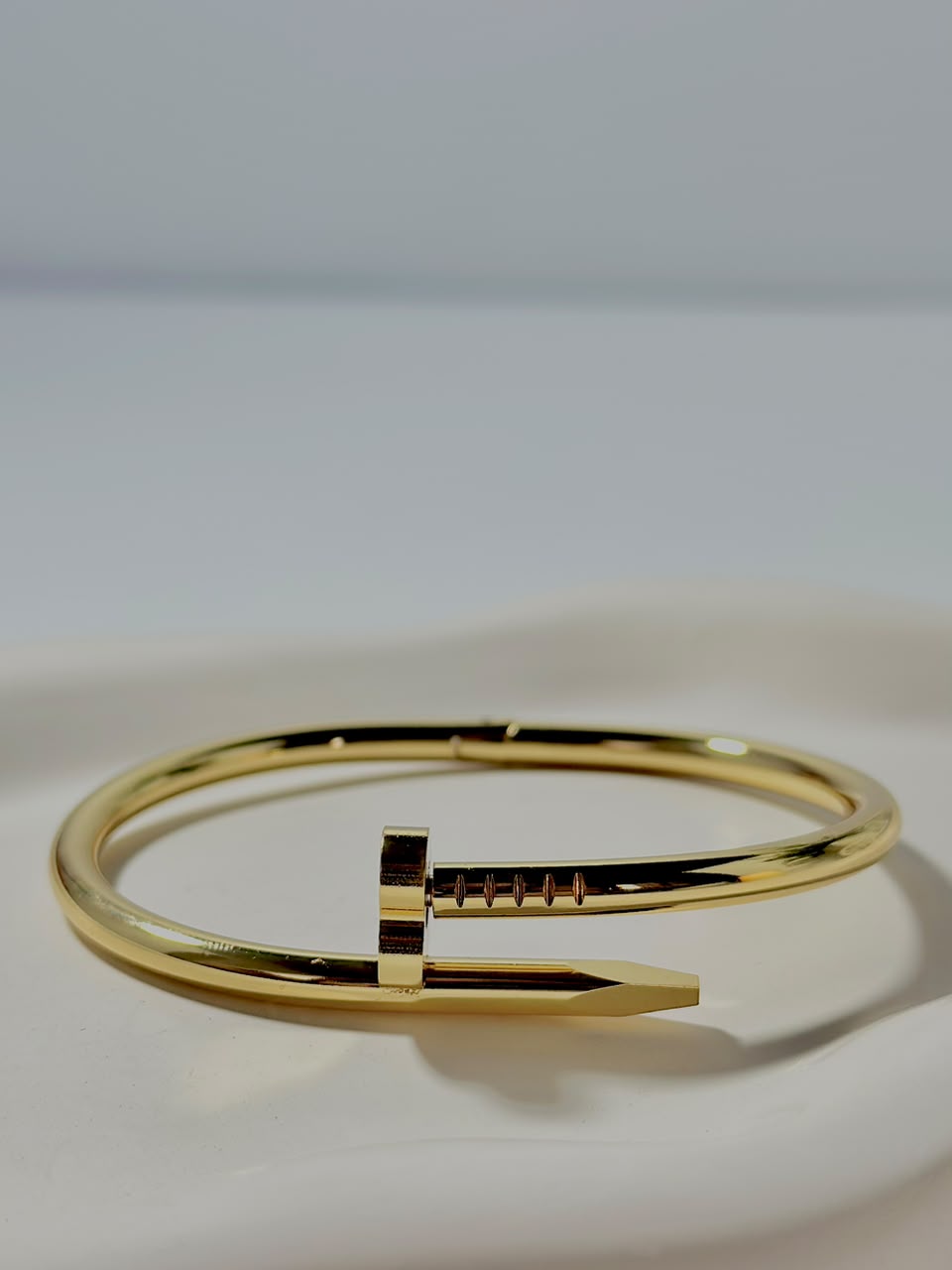 Bloslily Nail Heart Handcuff jewelry featuring a delicate nail-shaped heart cuff bracelet on a white background.