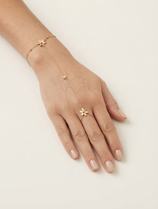 Elegant floral crystal hand chain jewelry by Bloslily featuring intricate floral designs and sparkling crystals on a delicate chain.