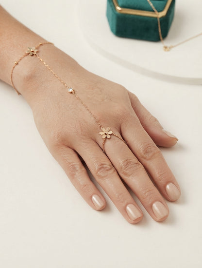Elegant floral crystal hand chain jewelry by Bloslily featuring delicate floral and crystal details on a chain.