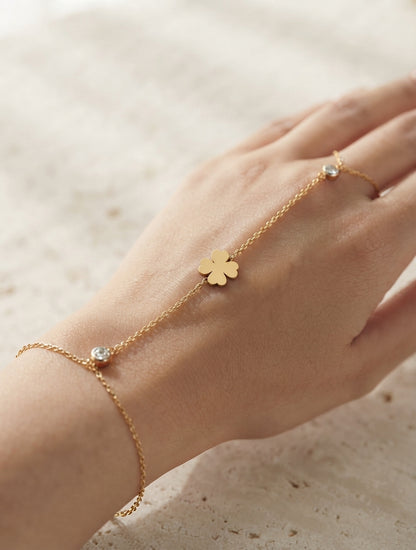 Dainty leaf and crystal hand chain jewelry by Bloslily, featuring delicate leaf design and sparkling crystals on a silver tone chain.