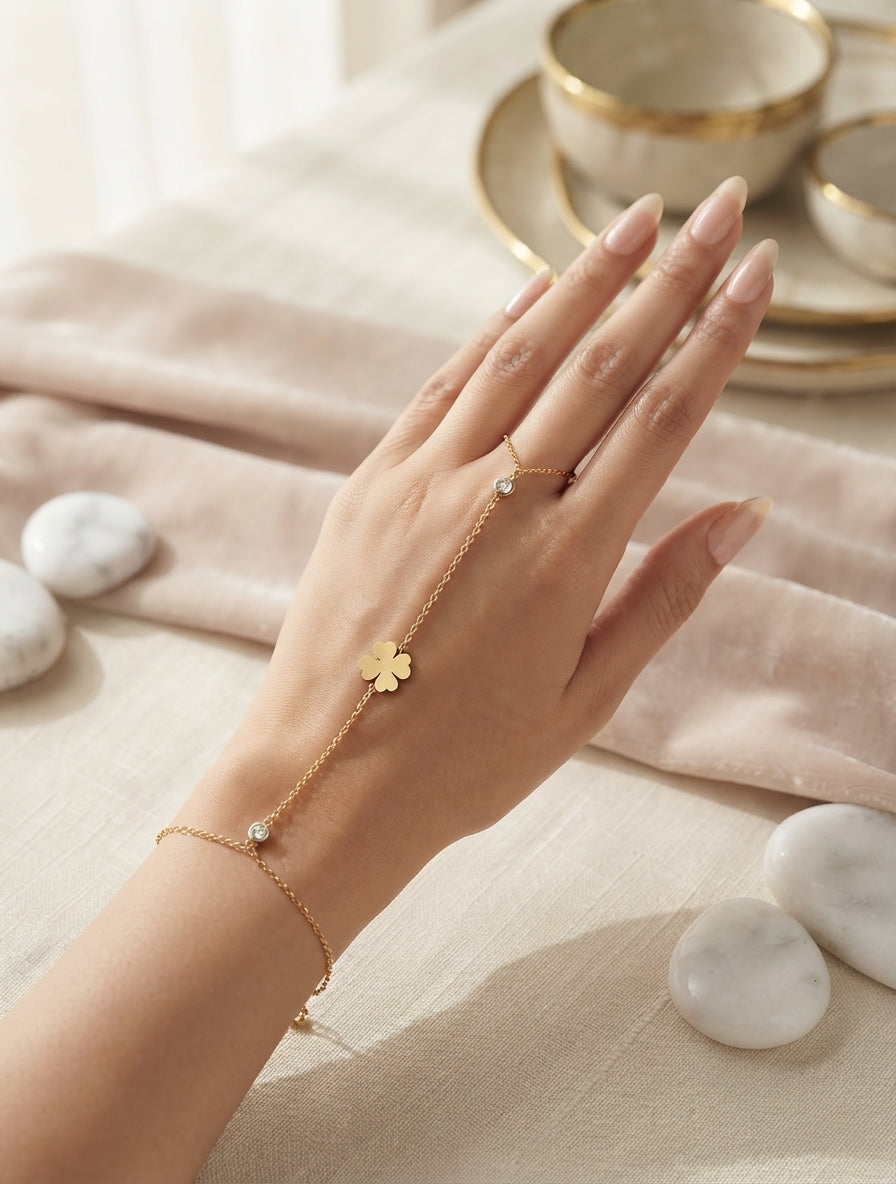 Dainty leaf and crystal hand chain jewelry by Bloslily featuring intricate leaf design and sparkling crystals on a delicate chain.