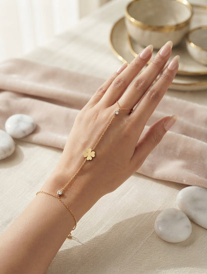 Dainty leaf and crystal hand chain jewelry by Bloslily featuring intricate leaf design and sparkling crystals on a delicate chain.