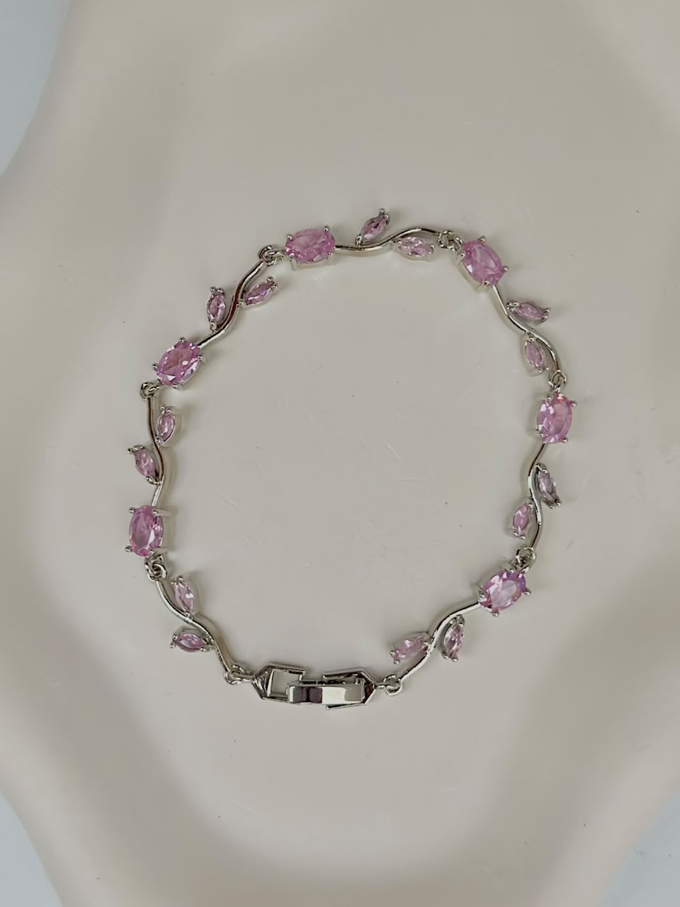 Pink and silver tulip-shaped jewelry bracelet by Bloslily, featuring delicate floral design and intricate metalwork.