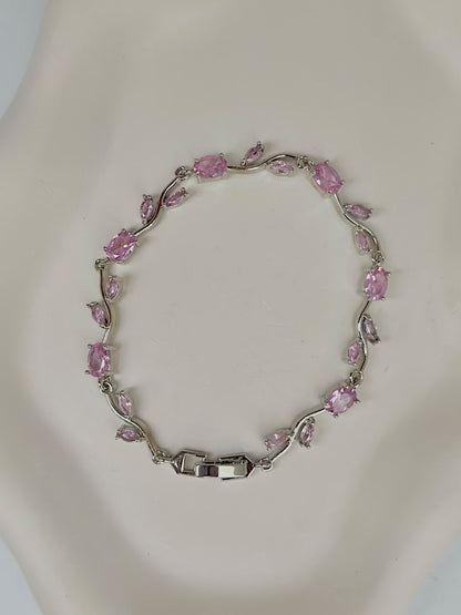 Pink and silver tulip-shaped jewelry bracelet by Bloslily, featuring delicate floral design and intricate metalwork.