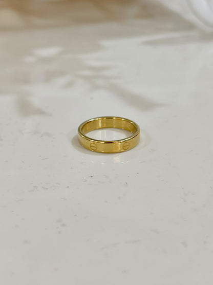 Golden Cartier Style Love Ring by Bloslily, showcasing a sleek jewelry design with intricate detailing and a polished finish.