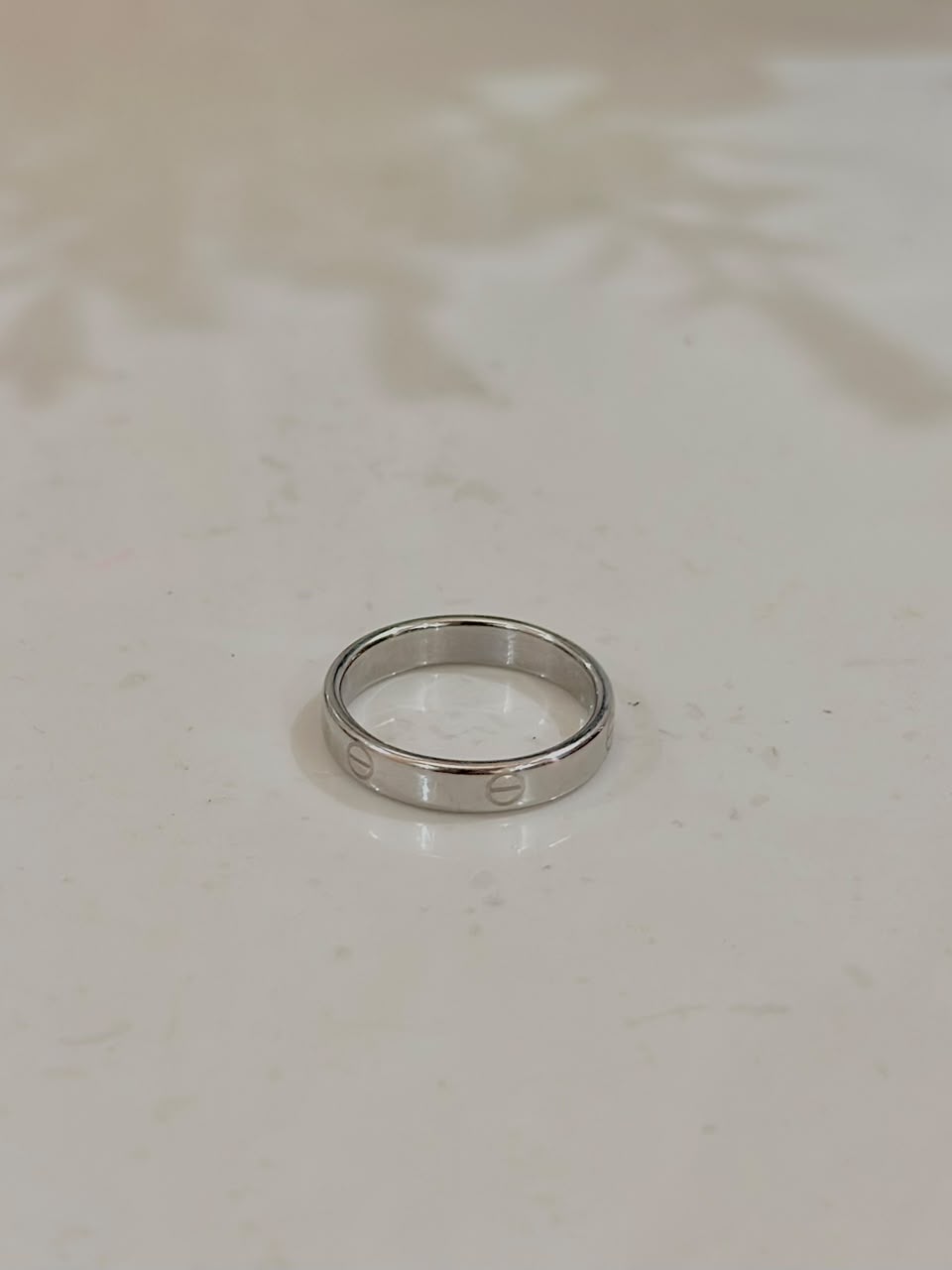 Silver Cartier Style Love Ring by Bloslily featuring a sleek band with signature Love design and engraved details.