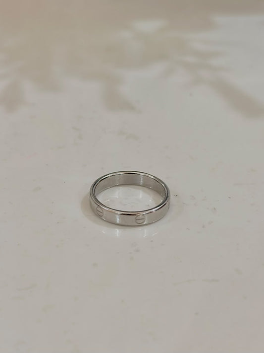 Silver Cartier Style Love Ring by Bloslily featuring a sleek band with signature Love design and engraved details.