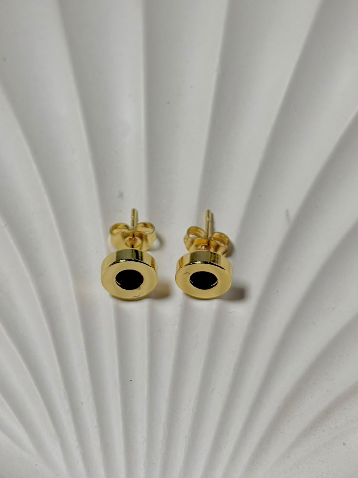 Black stone stud earrings by Bloslily, featuring sleek black jewelry with round black stones and silver settings.