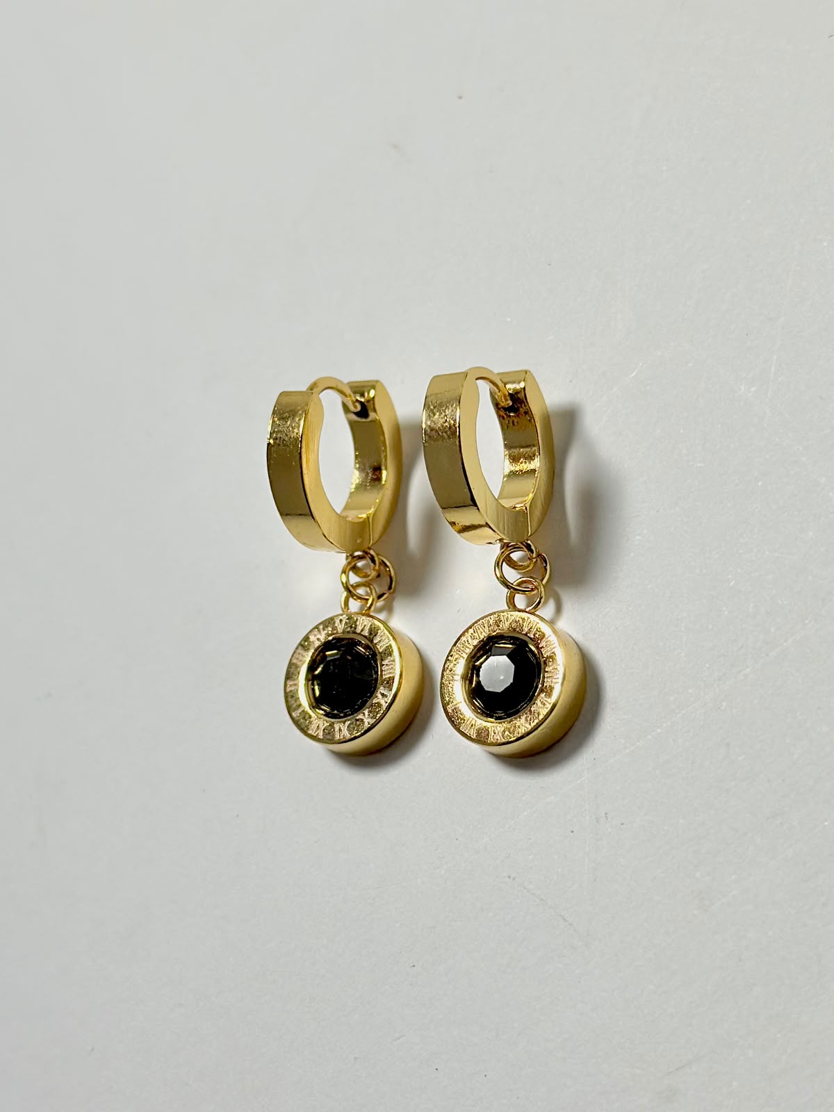 Black stone drop hoop earrings with Roman numeral design, by Bloslily jewelry, featuring sleek black stones and elegant hoop style.