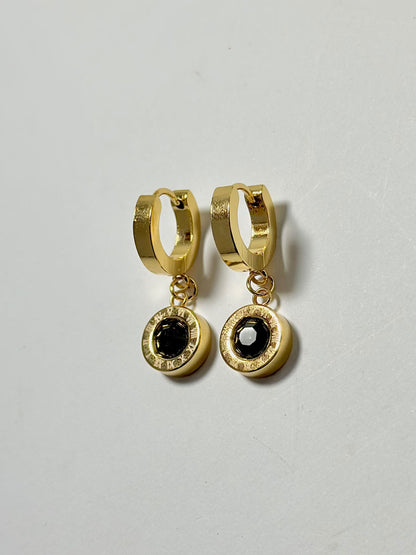 Black stone drop hoop earrings with Roman numeral design, by Bloslily jewelry, featuring sleek black stones and elegant hoop style.