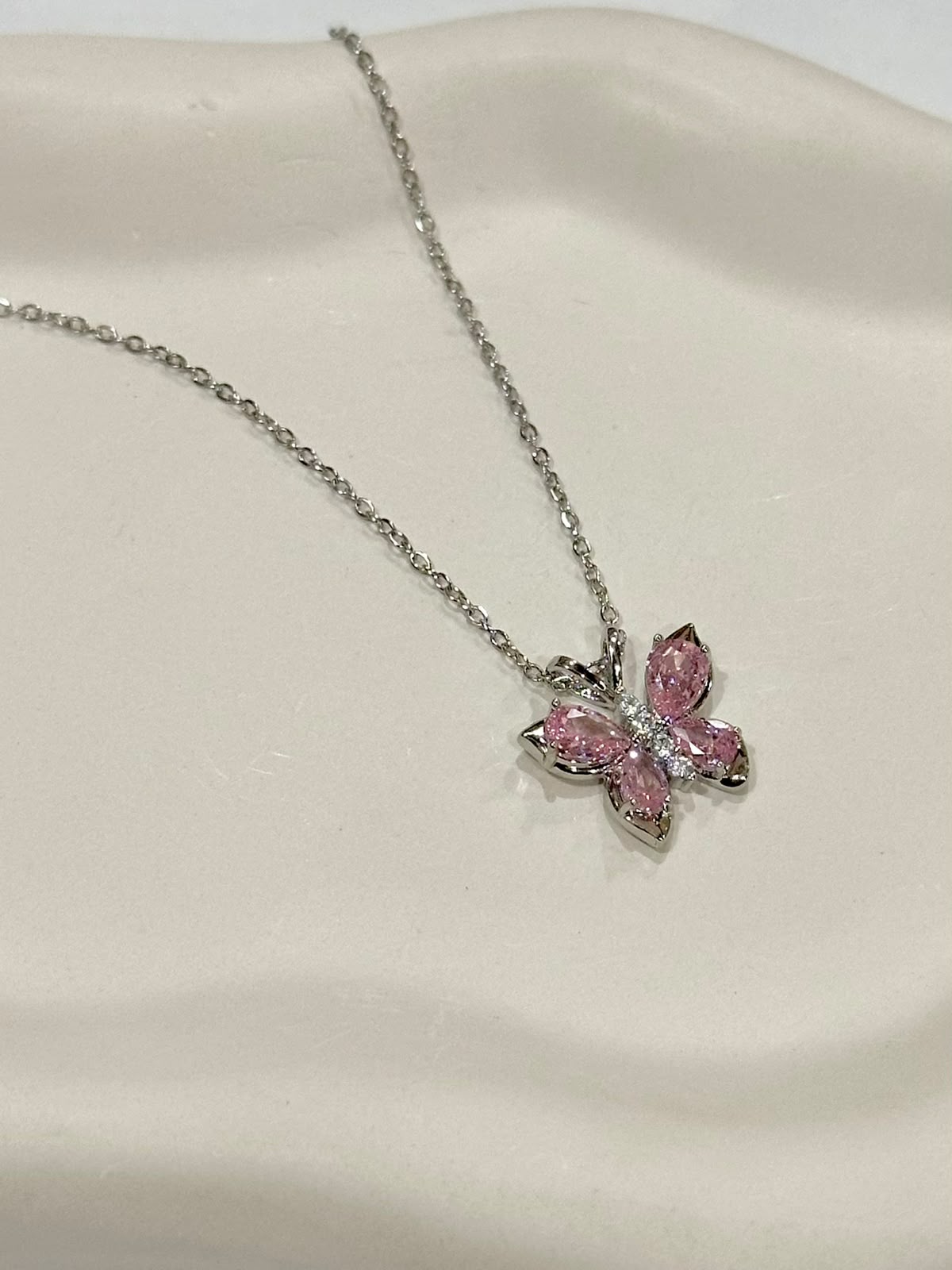 Elegant crystal butterfly necklace by Bloslily featuring a sparkling butterfly pendant on a delicate chain.