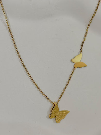 Bloslily dual butterfly frosted pendant necklace with two delicate butterfly charms on a fine chain, elegant jewelry accessory.