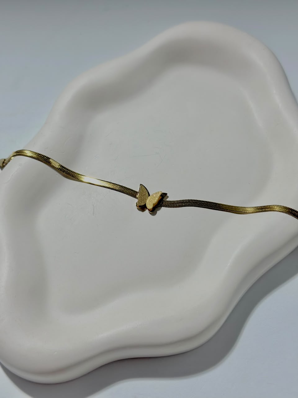 Frosted butterfly chain bracelet by Bloslily featuring a delicate jewelry design with double butterfly charms.