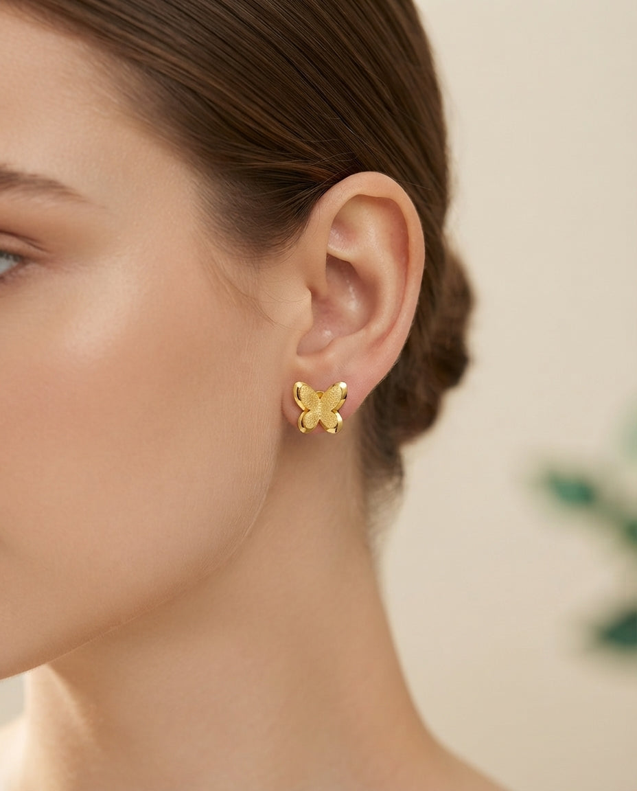 Bloslily textured frosted butterfly stud earrings featuring two delicate butterfly designs in a jewelry image.