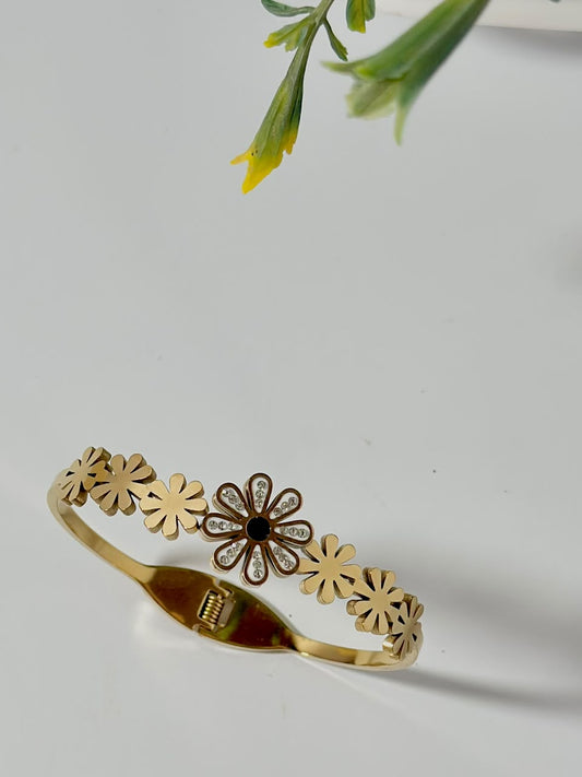 Bloslily Dainty Daisy Crystal Handcuff jewelry featuring a delicate flower design with sparkling crystals on a silver-tone bracelet.