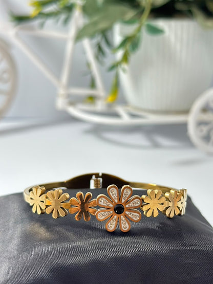Bloslily Dainty Daisy Crystal Bangle featuring delicate flower design with sparkling crystals on a sleek jewelry bracelet.