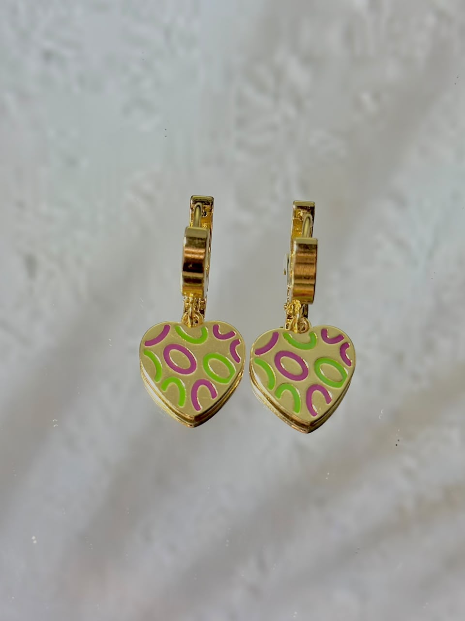 Green and purple heart pattern drop hoop earrings by Bloslily, featuring a jewelry design with heart-shaped accents and dangling hoops.