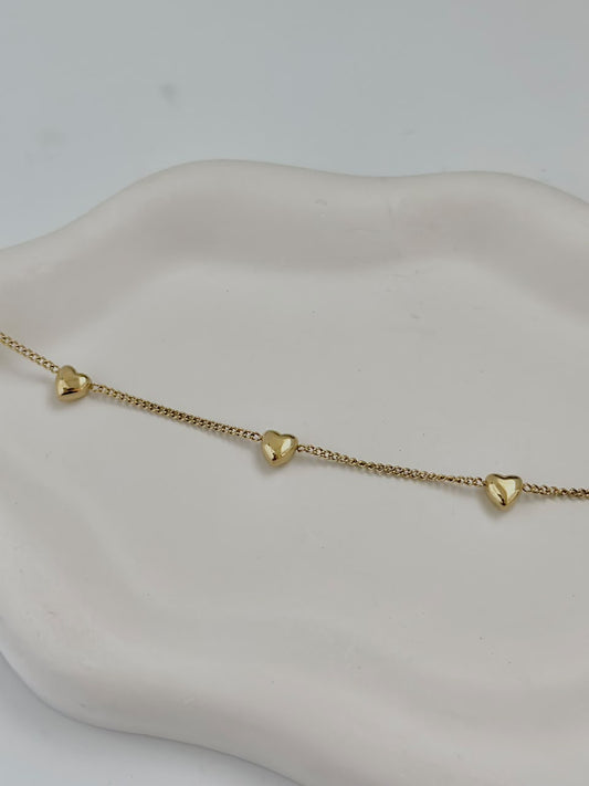 Bloslily multi-heart dainty charm bracelet featuring small heart-shaped charms on a delicate jewelry chain.