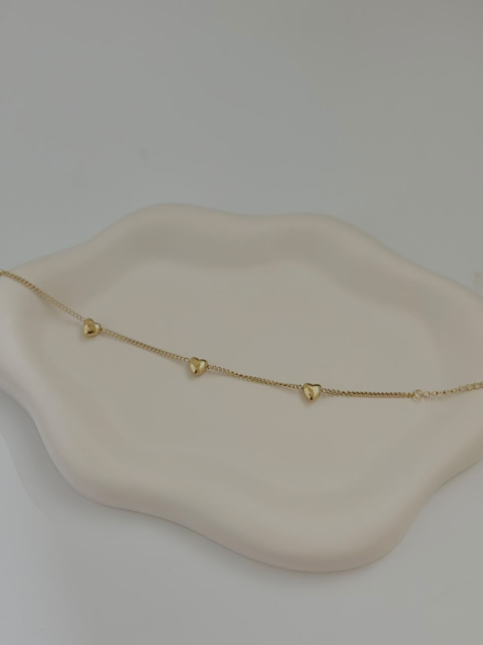 Bloslily multi-heart dainty charm bracelet featuring small heart-shaped charms on a delicate chain, jewelry accessory.
