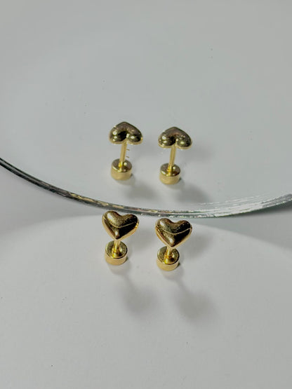 Bloslily Puffy Heart Screw-Back Stud Earrings in silver with a raised heart design, perfect for elegant jewelry styling.