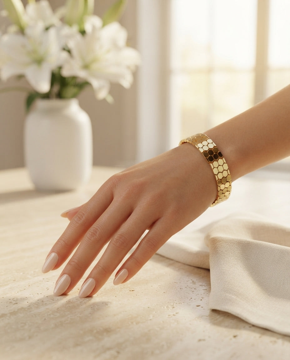 Silver honeycomb-shaped jewelry handcuff bracelet by Bloslily, featuring intricate honeycomb design and sleek metal finish