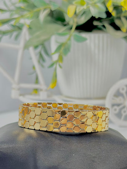 Bloslily jewelry honeycomb handcuff bracelet with gold-toned honeycomb design and intricate detailing.