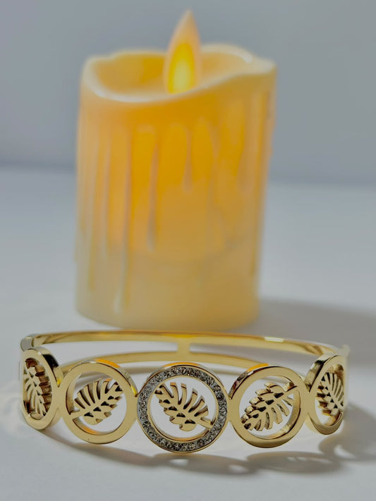 Bloslily Monstera leaf crystal handcuff jewelry featuring a detailed leaf design with sparkling crystals on a silver band.