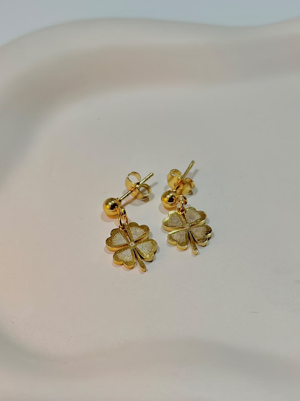 Textured four-leaf clover drop earrings by Bloslily featuring detailed jewelry with leaf-shaped design and elegant dangle style.