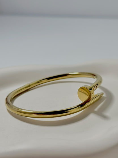 Silver nail-shaped jewelry handcuff from Bloslily, featuring a unique nail cuff design for edgy fashion accessories.