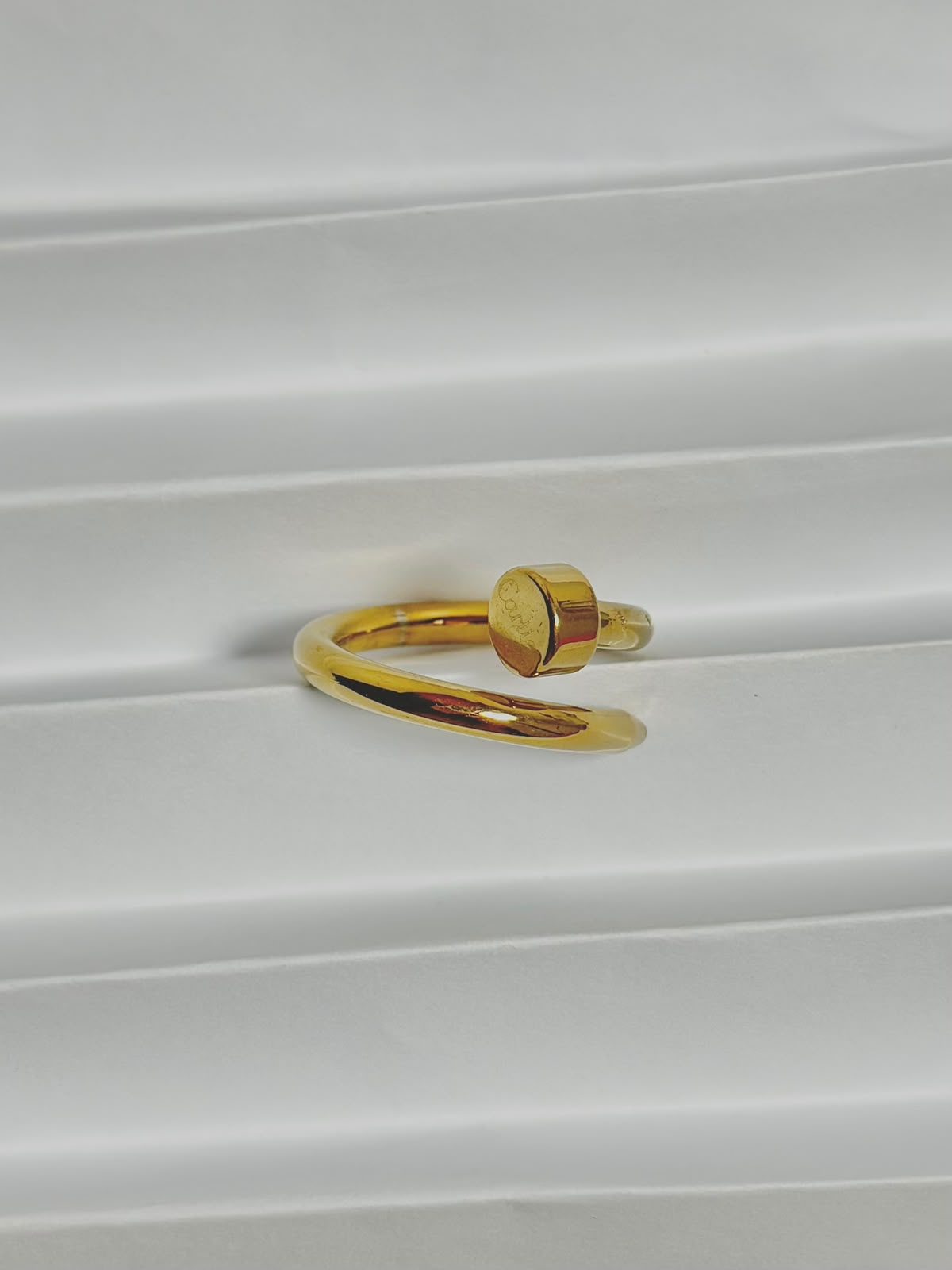 Silver nail ring jewelry by Bloslily featuring a sleek, modern design worn on a finger.