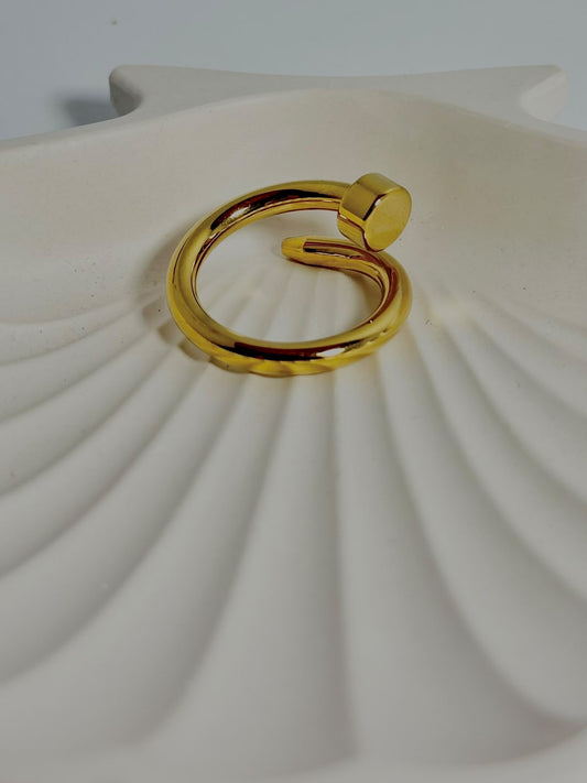 Silver nail ring jewelry by Bloslily featuring a sleek, modern design on a person's finger.