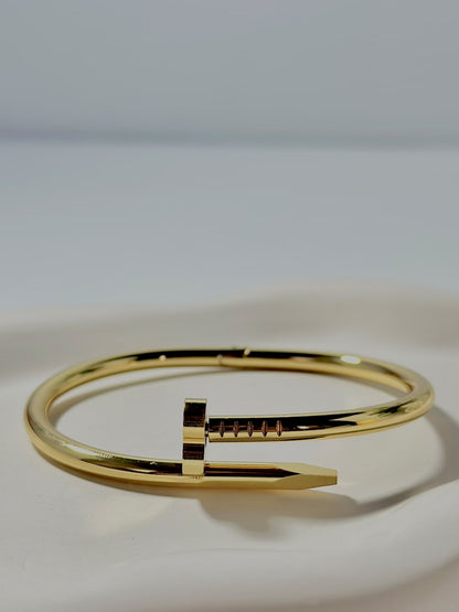 Bloslily Nail Heart Handcuff jewelry featuring a delicate nail-shaped heart cuff bracelet on a white background.