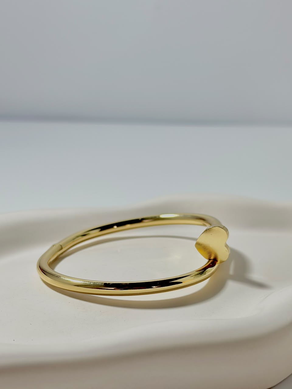 Silver Nail Heart Handcuff jewelry by Bloslily, featuring a unique nail and heart design on a sleek bracelet.