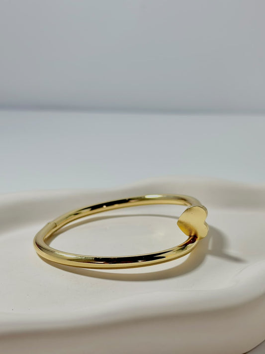 Silver Nail Heart Handcuff jewelry by Bloslily, featuring a unique nail and heart design on a sleek bracelet.