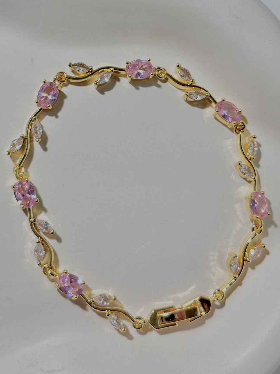 Pink and golden tulip-shaped jewelry bracelet by Bloslily featuring delicate floral design and elegant color accents.