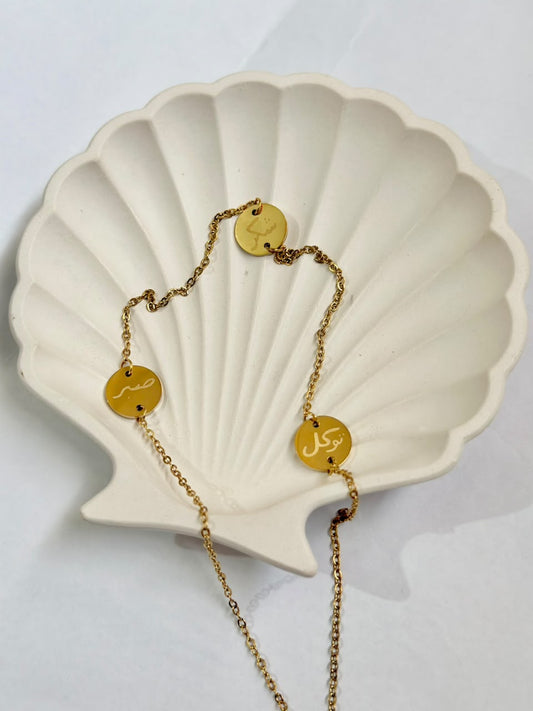Sabr, Shukr, Tawakkul coin charm necklace by Bloslily featuring metal coins and intricate jewelry design.