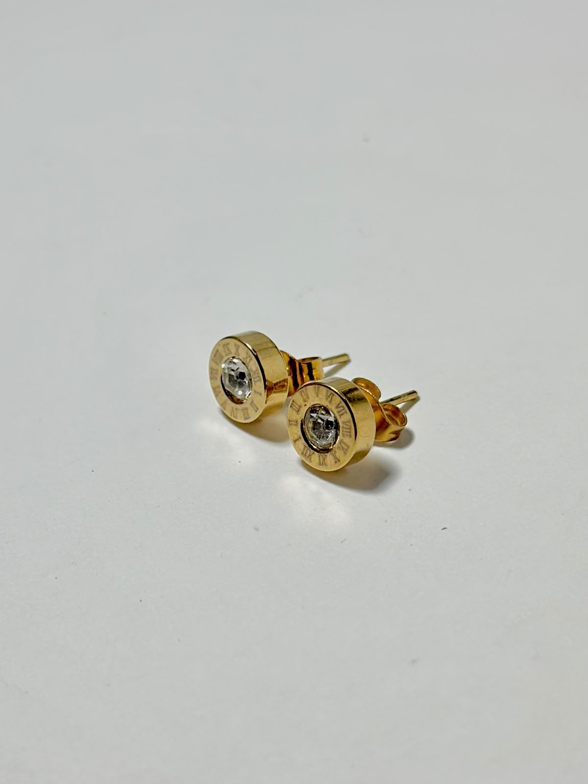 Silver Roman numeral crystal stud earrings by Bloslily, featuring sparkling crystal accents and minimalist jewelry design.