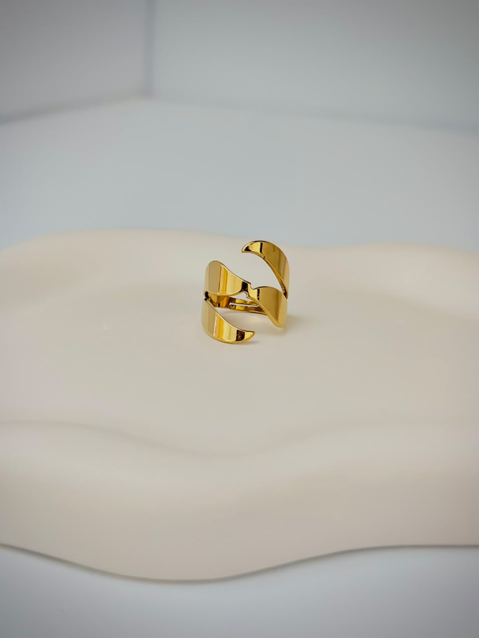 Bloslily multi-layer wrap adjustable ring featuring a spiral design, made of shiny metal with intricate layered details.