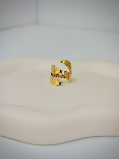 Bloslily multi-layer wrap adjustable ring featuring a spiral design, made of shiny metal with intricate layered details.