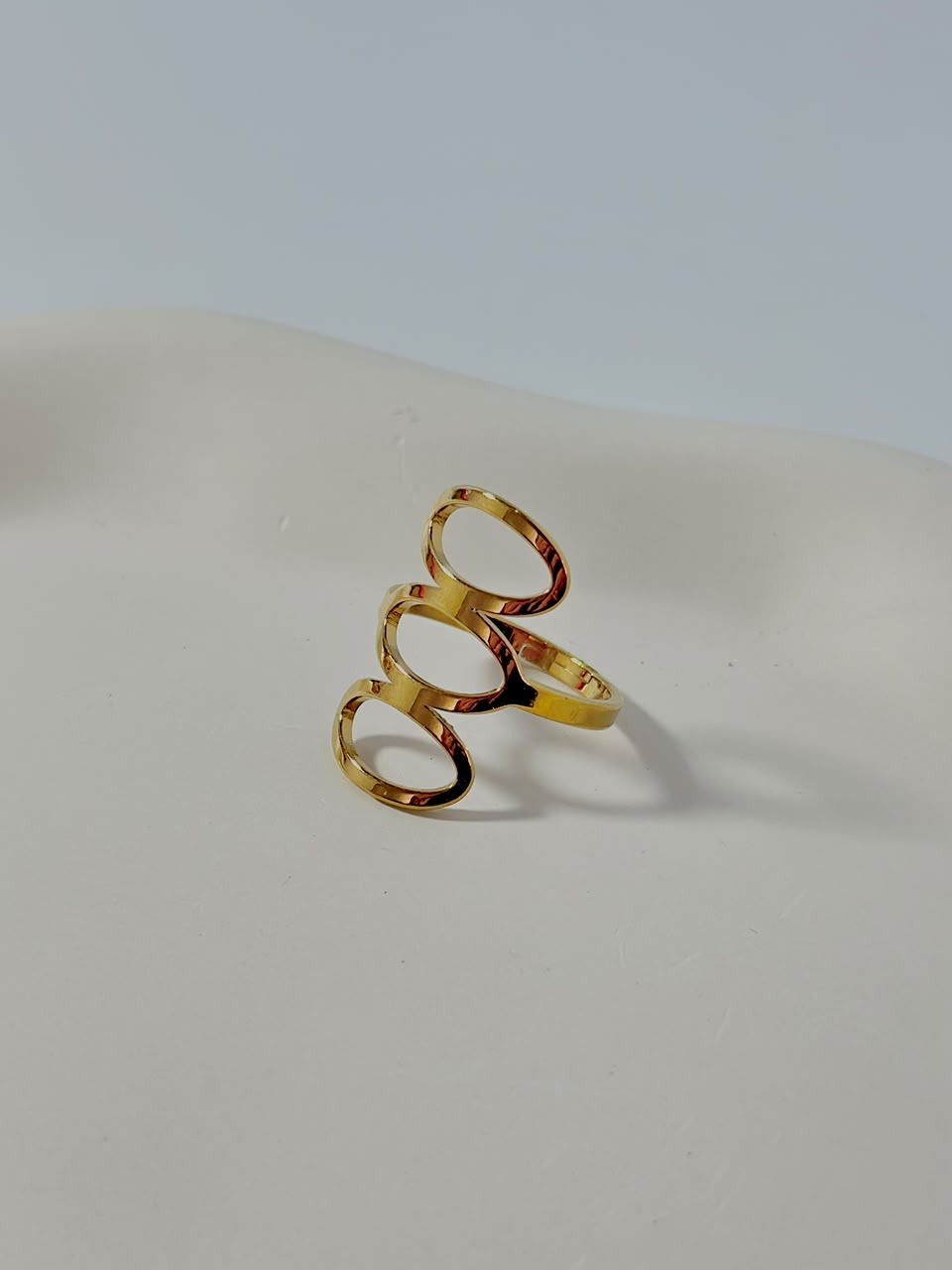 Silver Bloslily triple hollow oval adjustable jewelry ring with open design and smooth finish.